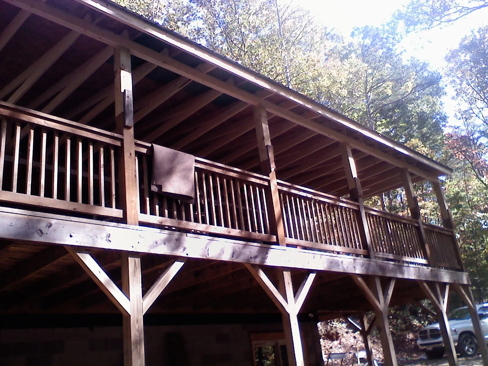 Timber framing under a new elevated porch and deck — Roof Leak Repair in Vermont by Roofing Brothers